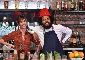 Jillionaire (R) of Major LaZer mixes up a custom cocktail with renowned New York bartender Ivy Mix (L) during the BACARDI Legacy fuel the hustle roundtable discussion in San Francisco, Calif. on April 25, 2016. (Josh Edelson/AP Images for BACARDI)